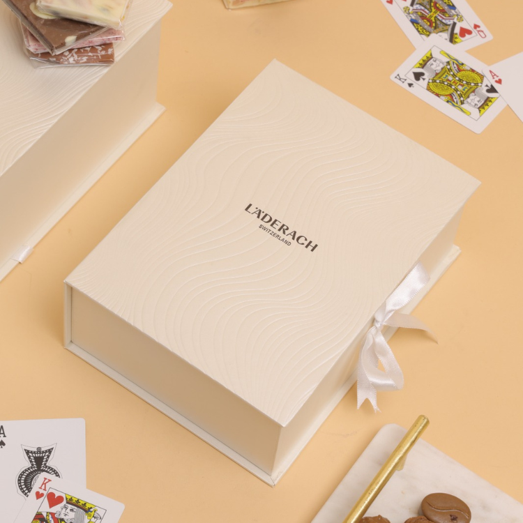 Assorted Pralines and Truffles (8 pieces) + Assorted FrischSchoggi (250 grams) + Assorted Tartufi (4 pieces) + Tablet (1 Piece) + Popcorn (1 Piece) + Deck of cards (2)